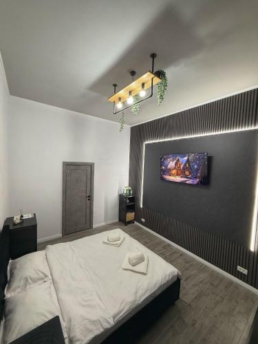 En eller flere senge i et værelse på City Center 1898Apartments