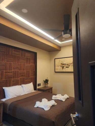 Postel nebo postele na pokoji v ubytování Socram GH