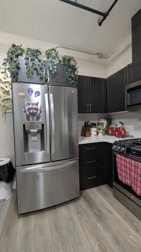 a kitchen with a large stainless steel refrigerator at The Downtown Gem Toronto in Toronto