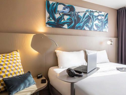 Postel nebo postele na pokoji v ubytování ibis Styles Paris Bercy