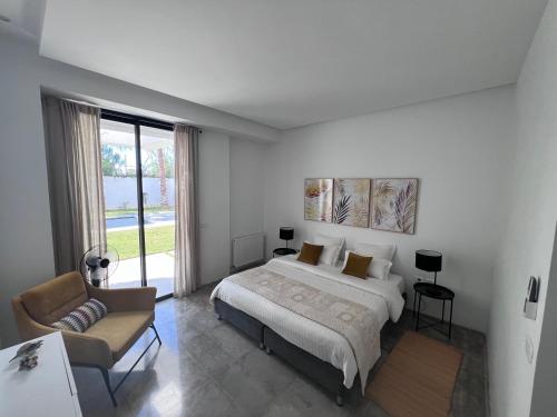 Postel nebo postele na pokoji v ubytování Dar El Musc