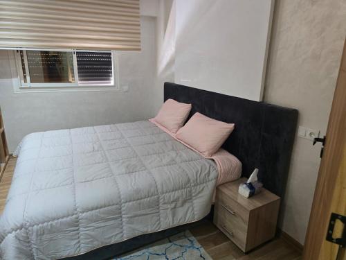 Ένα ή περισσότερα κρεβάτια σε δωμάτιο στο Appartement meublé