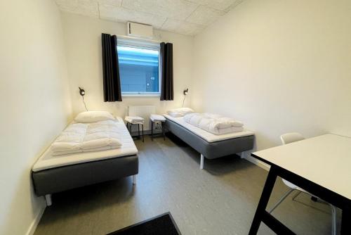 Postel nebo postele na pokoji v ubytování Smart-Stay-Padborg