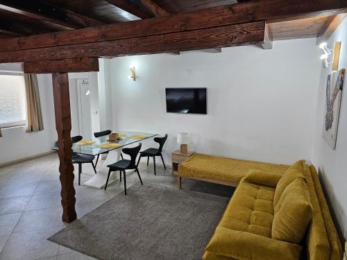 a living room with a couch and a table at SOBE AVA in Palić