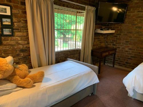 Ένα ή περισσότερα κρεβάτια σε δωμάτιο στο Lapa Phanzi