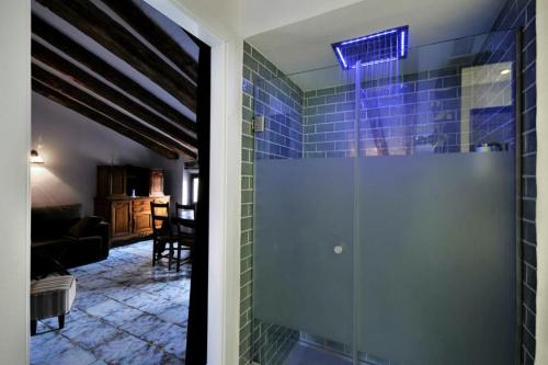 a glass door to a room with a living room at La Casa Grande de Albarracín in Albarracín