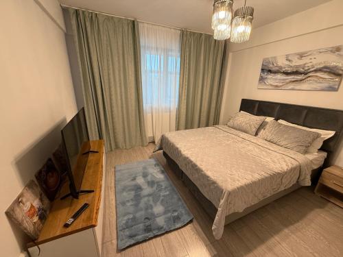 Postel nebo postele na pokoji v ubytování Vibe apartaments