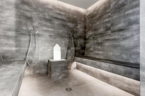 a bathroom with a shower and a candle in it at Regina's Alp deluxe in Sölden