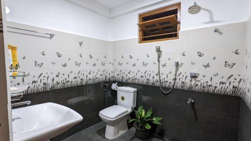 a bathroom with a toilet and a sink at MPR villa in Tangalle