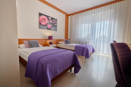 Ένα ή περισσότερα κρεβάτια σε δωμάτιο στο Tennis- und Freizeitzentrum Neudörfl