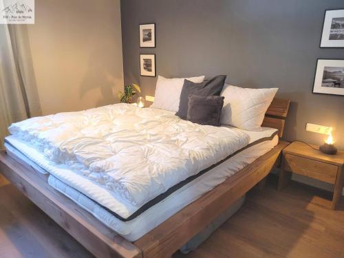 Postel nebo postele na pokoji v ubytování Auszeit in den Alpen