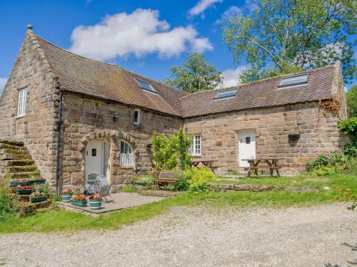 an old stone house with a patio in front of it at Nightingale Cottage - Ukc1570 in Crich