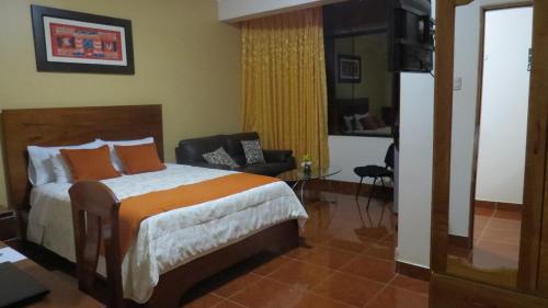 Katil atau katil-katil dalam bilik di Victtorios Hotel