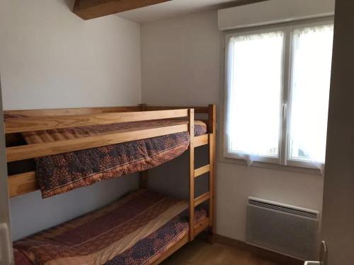 En eller flere senge i et værelse på Maison familiale spacieuse à Les Sables-d'Olonne