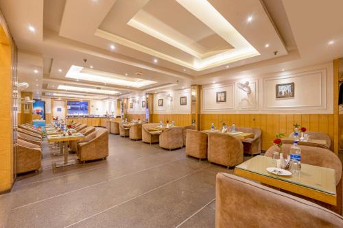 Χώρος καθιστικού στο Aman Continental With Restaurant - 5Mins from Connaught Place ,Railway Station & Metro