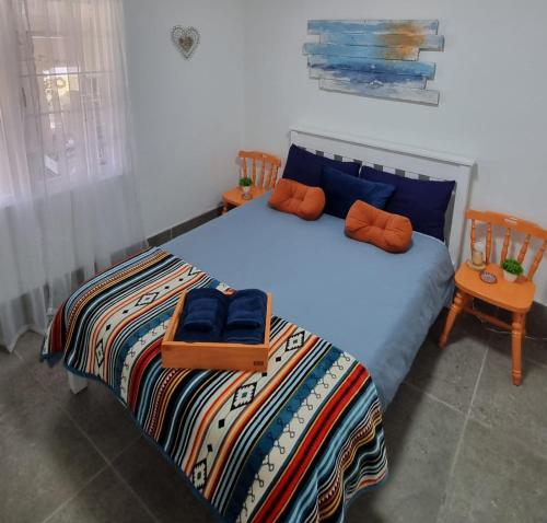 Ένα ή περισσότερα κρεβάτια σε δωμάτιο στο Agulhas Stay