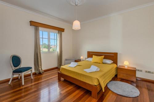 En eller flere senge i et værelse på Casa dos Amigos