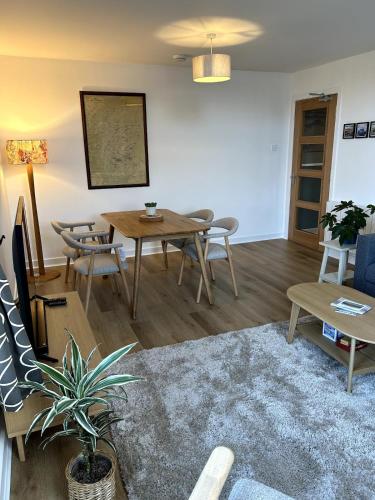 a living room with a table and chairs at Apartment in Highlands of Scotland - Fort William in Fort William