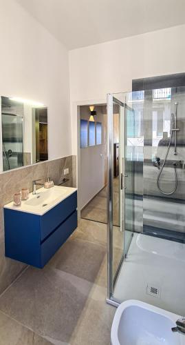 a bathroom with a sink and a shower and a tub at Borgo Marchetti in Camerano