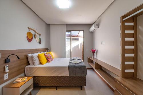 Ένα ή περισσότερα κρεβάτια σε δωμάτιο στο Conforto 5 Estrelas em Barra - 2 suítes!