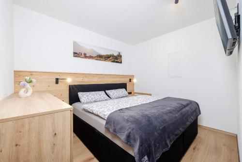 Ένα ή περισσότερα κρεβάτια σε δωμάτιο στο Ferienwohnung Persal