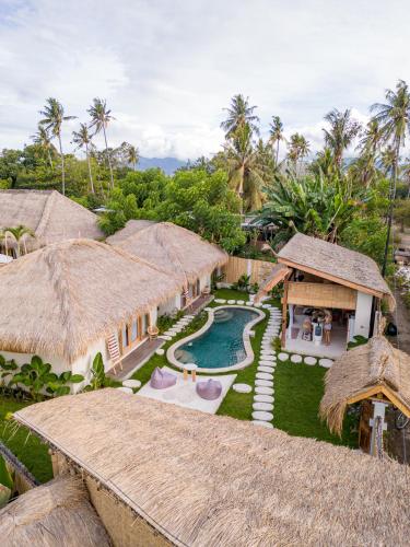an aerial view of a resort with a swimming pool at Villa Nyantara - Private tropical villa in Gili Islands