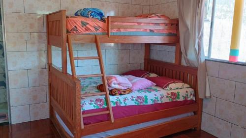 a bunk bed with a little girl sleeping on the bottom bunk at Point da ilha in Belém