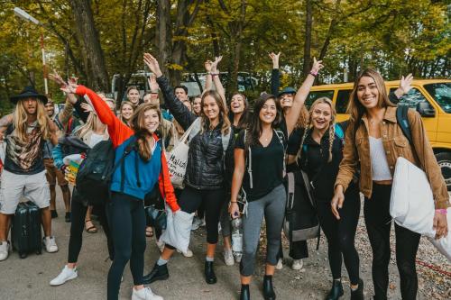 a group of people standing in the street with their hands in the air at Munich Oktoberfest Basic Camping in Munich