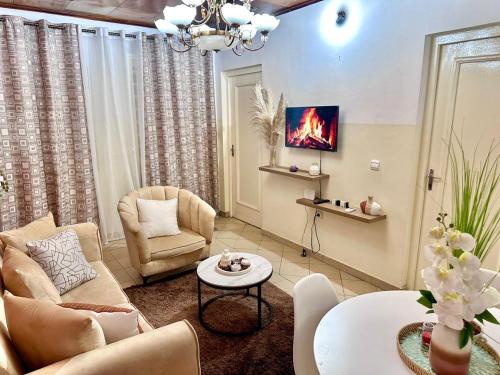 Posezení v ubytování Appartement meublé cosy - Brazzaville