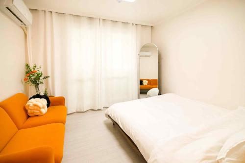 Postel nebo postele na pokoji v ubytování Ongi House