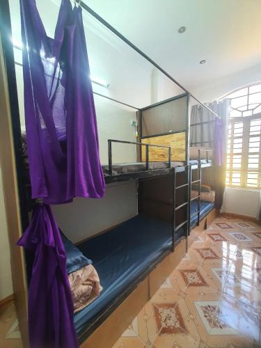 Ένα ή περισσότερα κρεβάτια σε δωμάτιο στο Poem Hostel