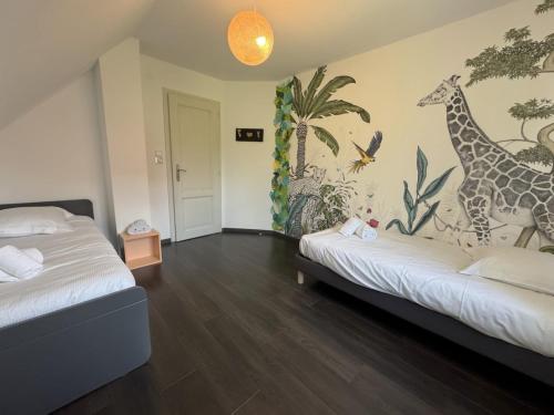 Postel nebo postele na pokoji v ubytování Vogelgarten - Villa 10 couchages entre vignes et chants d'oiseaux