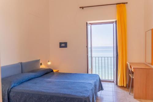 Ένα ή περισσότερα κρεβάτια σε δωμάτιο στο Lido Paradiso Resort