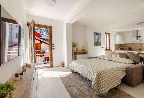 Ένα ή περισσότερα κρεβάτια σε δωμάτιο στο La Rondinella 2 bedr apt 10 min from Bernina Exp