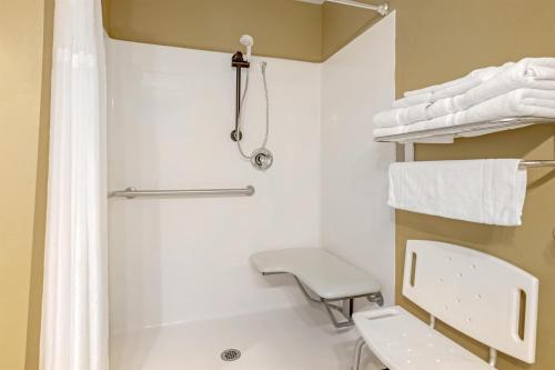 a white bathroom with a shower and a toilet at Best Western Plus Canyon Pines in Ogden
