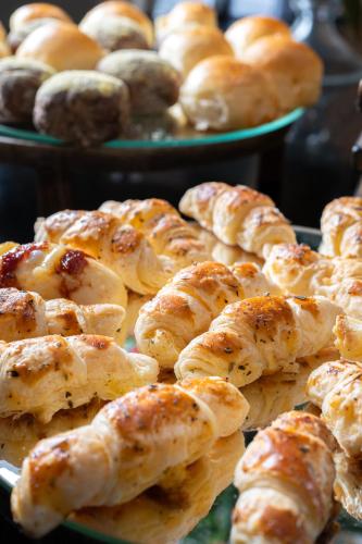 a bunch of pastries on plates on a table at Américas Copacabana Hotel in Rio de Janeiro