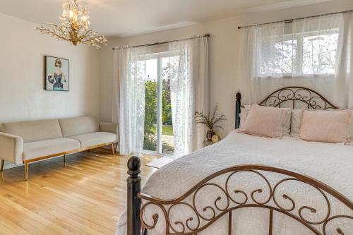 a bedroom with a bed and a couch and windows at Work and Relax! Updated Walnut Creek Home with Office in Walnut Creek