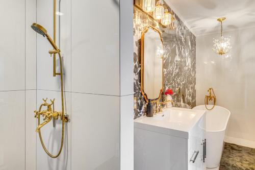 a bathroom with a shower and a sink and a mirror at Work and Relax! Updated Walnut Creek Home with Office in Walnut Creek