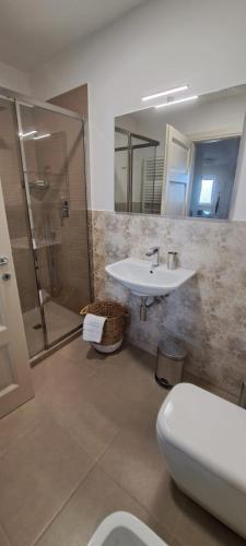 a bathroom with a sink and a shower and a toilet at I Rioni di Perugia in Perugia