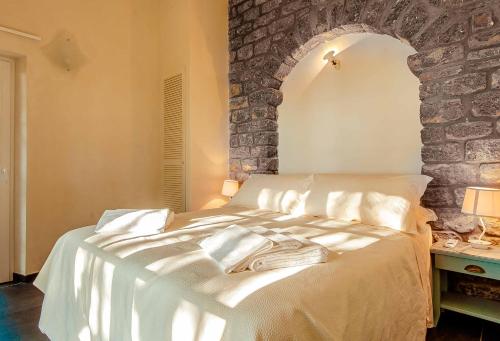 מיטה או מיטות בחדר ב-VILLA CASTELLo PORTOVENERE