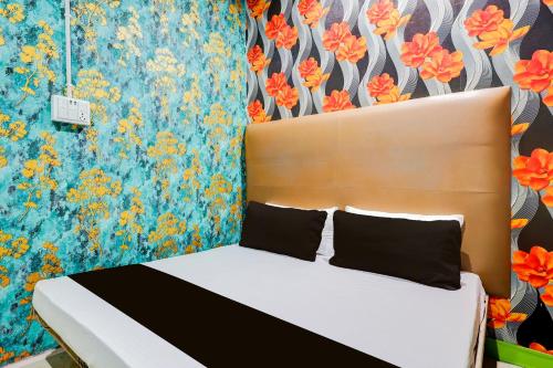 Ένα ή περισσότερα κρεβάτια σε δωμάτιο στο Hotel O Shotel