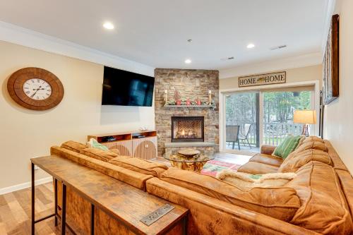 a large couch in a living room with a fireplace at Relaxing Lincoln Condo with Fireplace and Shuttle in Lincoln