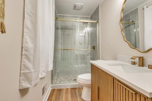 a bathroom with a shower and a toilet and a sink at Comfort and Convenience! Home 3 Mi to Dtwn Wilson in Wilson