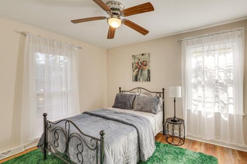 a bedroom with a bed and a ceiling fan at Comfort and Convenience! Home 3 Mi to Dtwn Wilson in Wilson