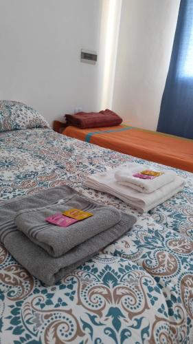 En eller flere senge i et værelse på Alquiler Temporario Oliva