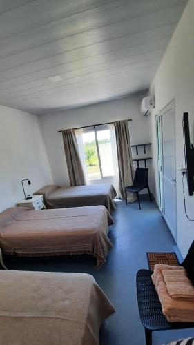 Postel nebo postele na pokoji v ubytování Los Abu Dormis