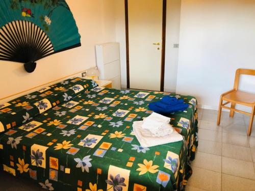 Postel nebo postele na pokoji v ubytování Trilocale Corallo 300 mt spiaggia