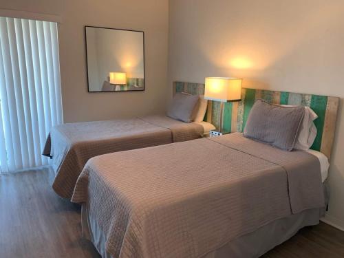 Ένα ή περισσότερα κρεβάτια σε δωμάτιο στο Pinecrest #4- 2 Bedroom4 Twin Bedspark 2 Cars