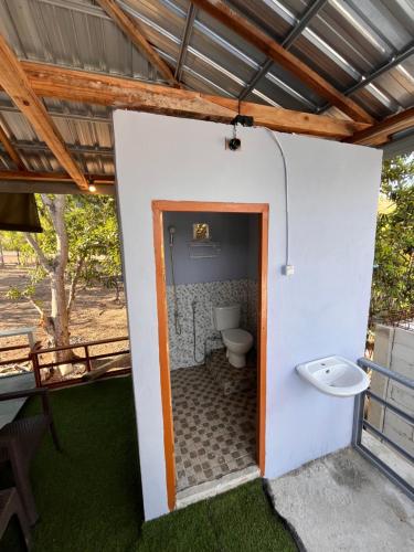 a bathroom with a toilet inside of a building at Modo homestay komodo village in Komodo