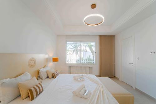 Ένα ή περισσότερα κρεβάτια σε δωμάτιο στο Villa Oasis Chotrana